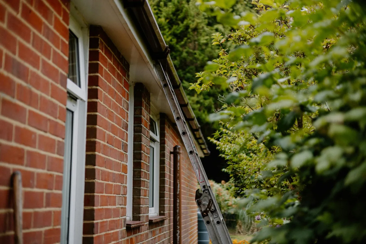 A brick house with a front garden