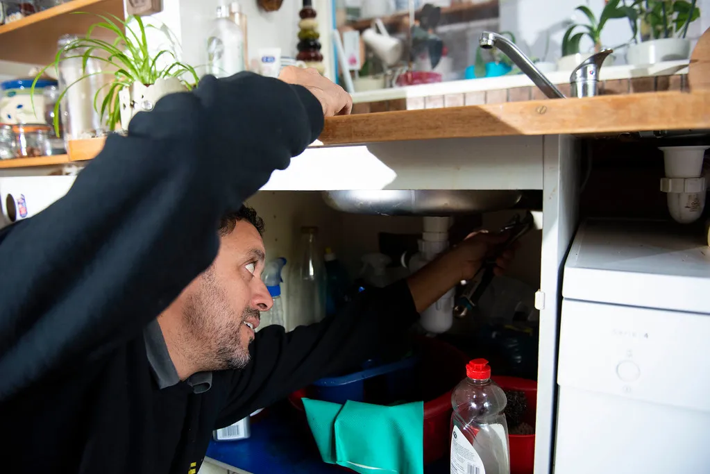 we care home improvements handyperson handyman plumber sink trap leak repair